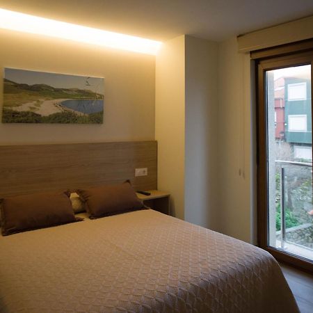 Apartamentos turisticos HAZ AMIGO Muxía Quarto foto