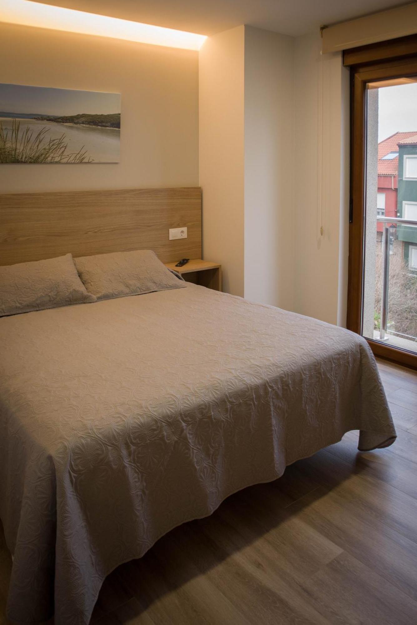 Apartamentos turisticos HAZ AMIGO Muxía Quarto foto
